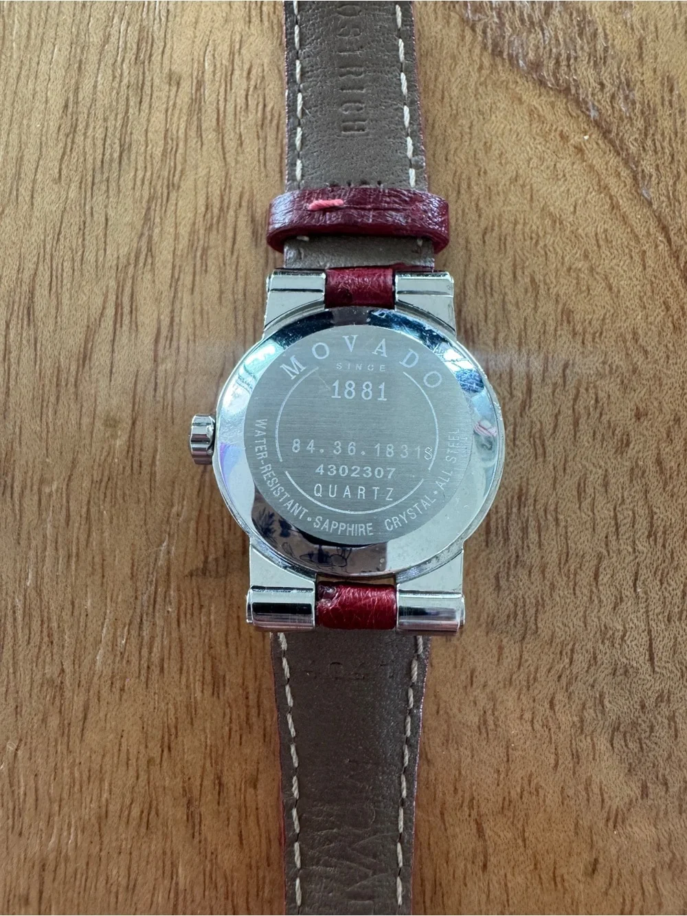 VZO Movado Ladies Watch w/ Diamond Bezel. Red leather strap. Pristine condition.